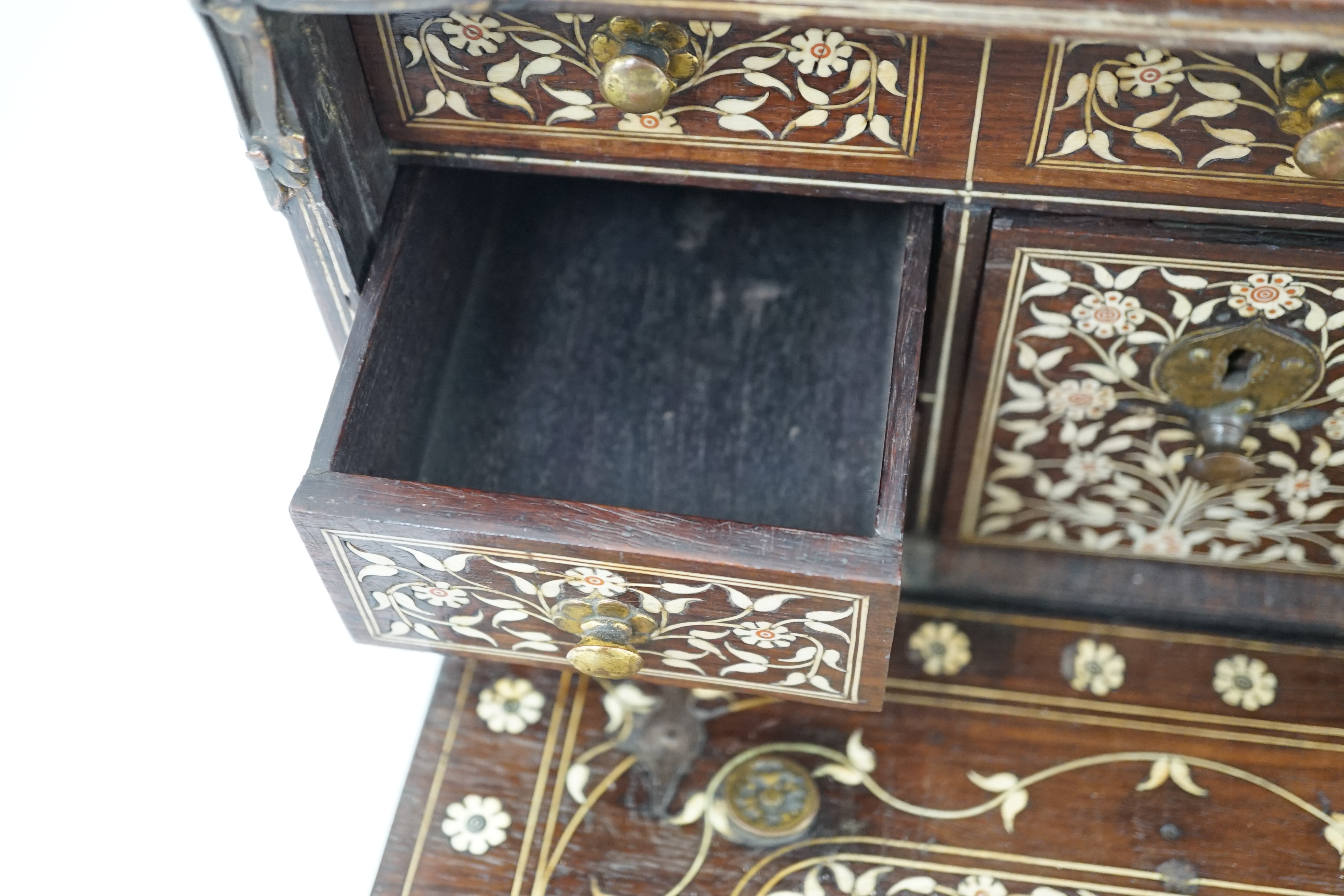 An early 17th century Indo-Portuguese ivory inset hardwood travelling chest